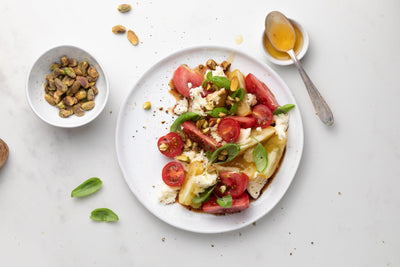 Food styling: Tomato and mozzarella salad with honey & pistachios