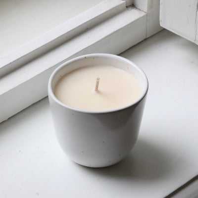Scented candle in a cappuccino cup