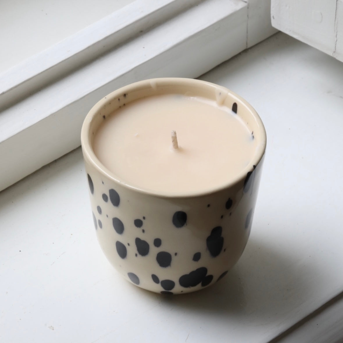 Scented candle in a cappuccino cup