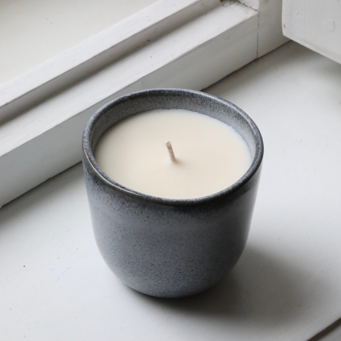 Scented candle in a cappuccino cup