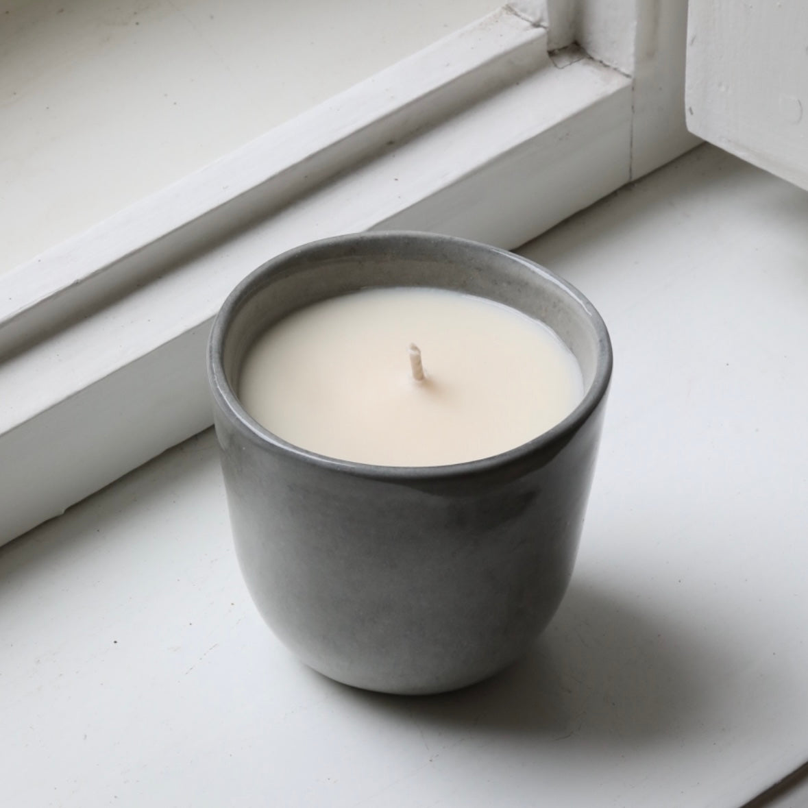 Scented candle in a cappuccino cup