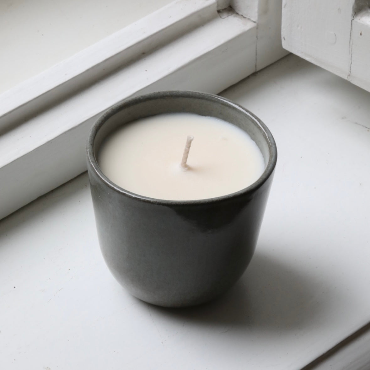 Scented candle in a cappuccino cup