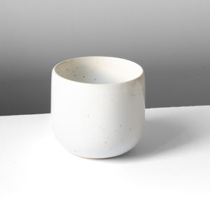 White Latte Serra coffee mug for latte macchiato on a white table.