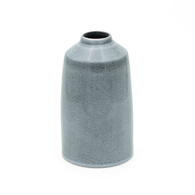 Simple blue vase that gets smaller towards the top and offers a stable opening for bouquets