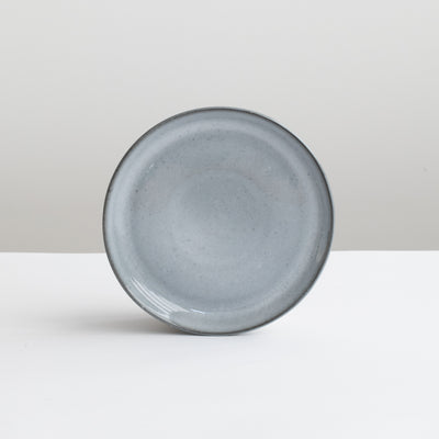 The small tapas plate is dark gray-blue like the stormy sea with a slightly thinner rim