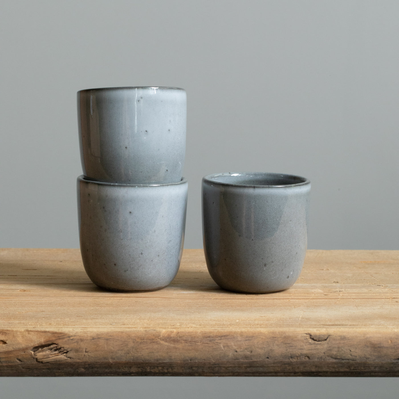 Three dark gray stacked ristretto cups also suitable for espresso