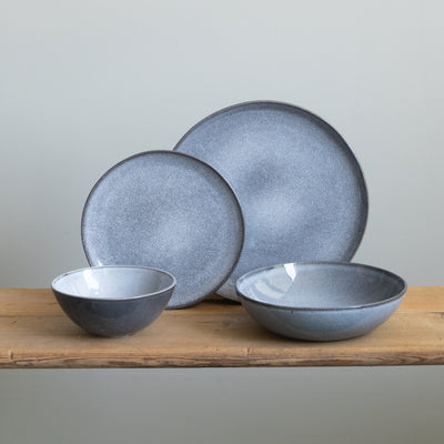 Complete stoneware tableware set with large and small plates, cereal bowl and pasta plate in mottled blue