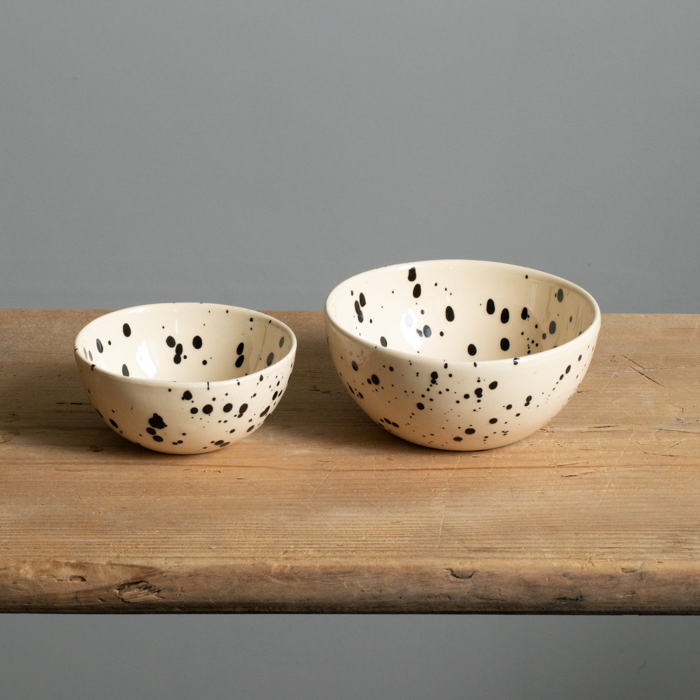 small and large snack bowl side by side in beige color with black dots