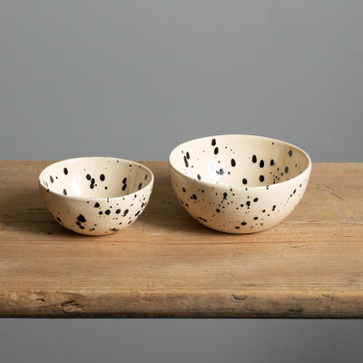 small and large snack bowl side by side in beige color with black dots