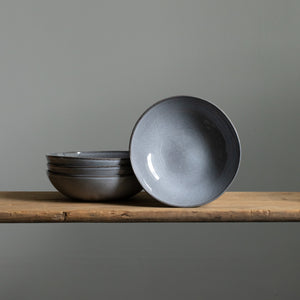 Deep pasta plate stacked and set up in Blue Sand glaze 
