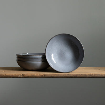 Deep pasta plate stacked and set up in Blue Sand glaze 