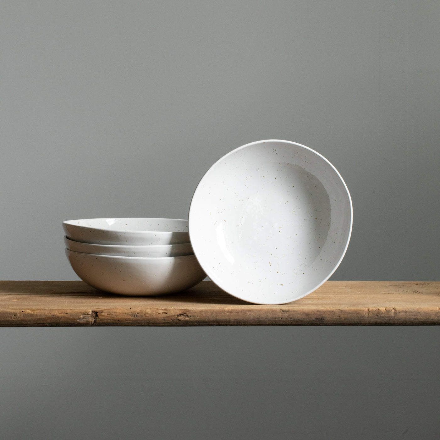 White pasta plate with fine golden dots made of stoneware