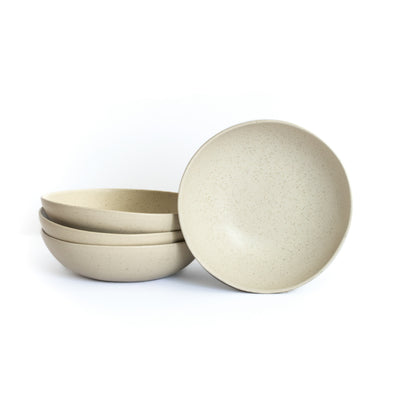 Large round pasta plate cropped against a white background