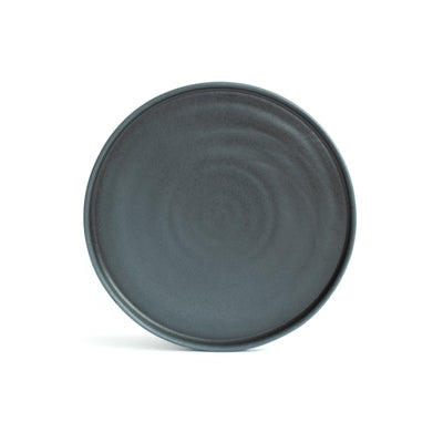 Large main course plate with straight edge placed and cropped in front of a white background