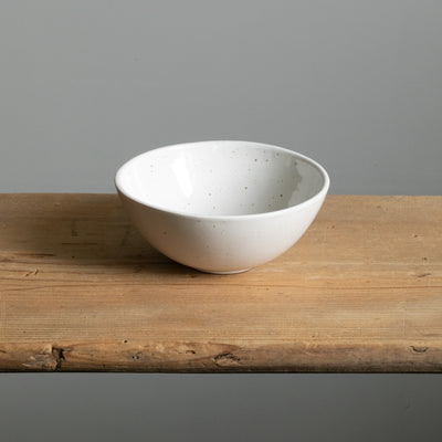 Breakfast bowl in white seen slightly from above the rim goes slightly outwards 