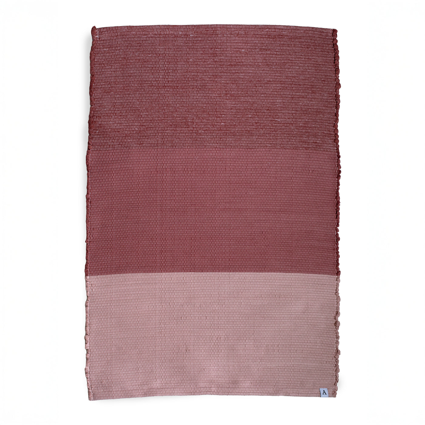 Carpet divided into three color blocks from bordeaux to pink against a white background