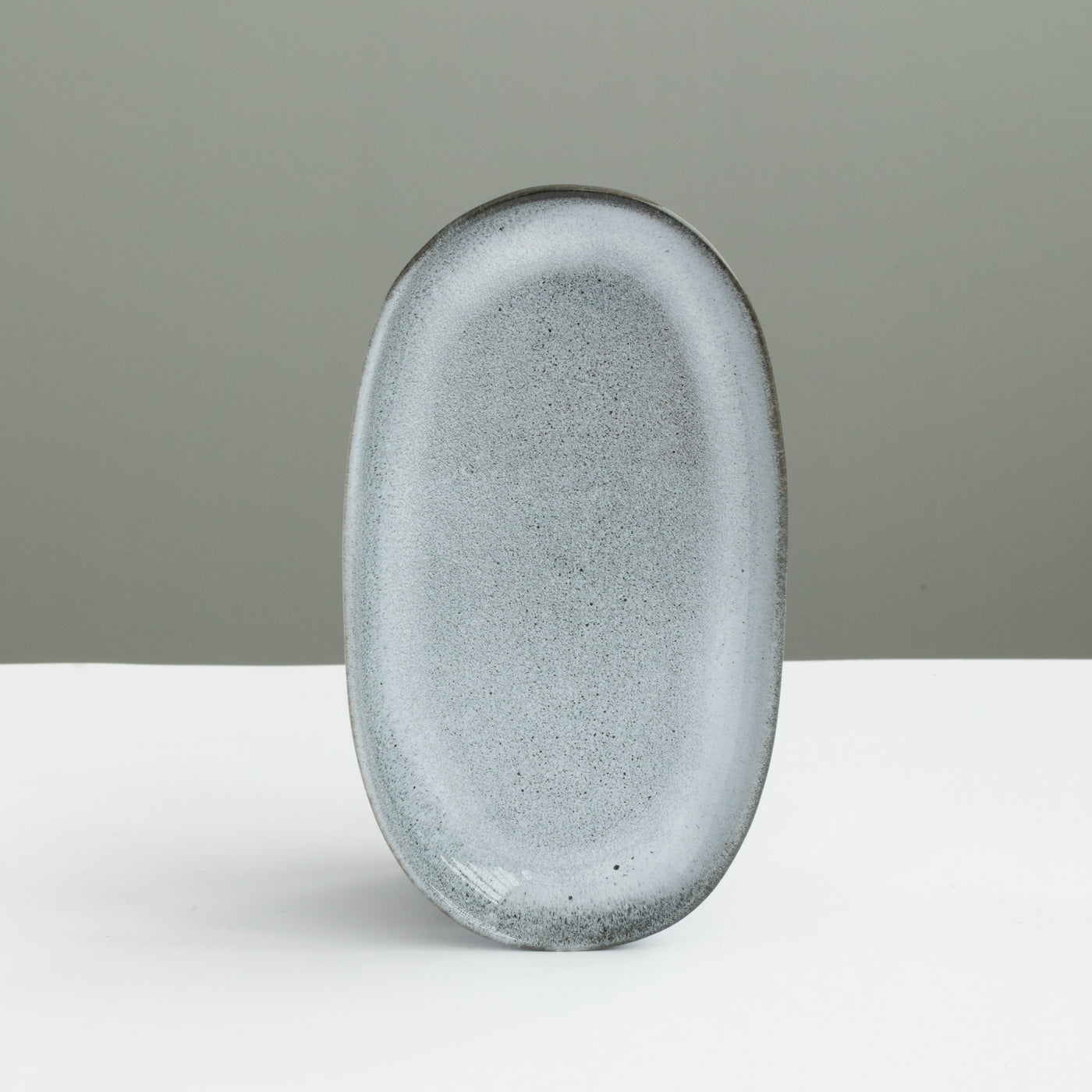 22cm long oval plate set up perfectly as a saucer or starter plate in reactive blue mottled glaze