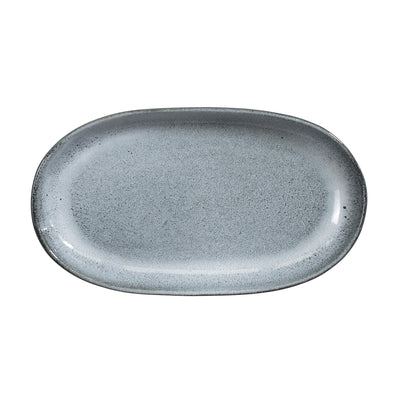 Blue saucer cropped against a white background