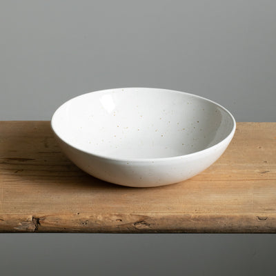 White round organic plate with raised sides perfect for dishes with sauce