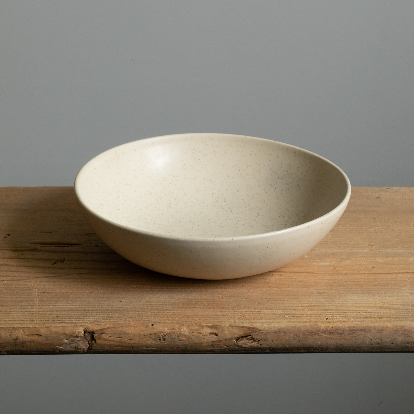 Deep matt beige pasta plate photographed from above made of stoneware made in Portugal