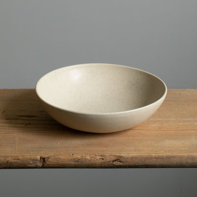 Deep matt beige pasta plate photographed from above made of stoneware made in Portugal