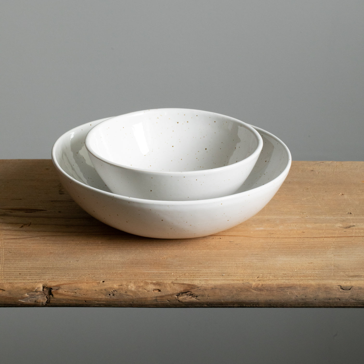 A small breakfast bowl is placed on a large deep pasta plate to easily see the big difference