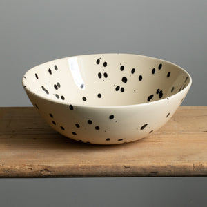 Large bowl suitable for salad or dough in the color cream with black splashes of color