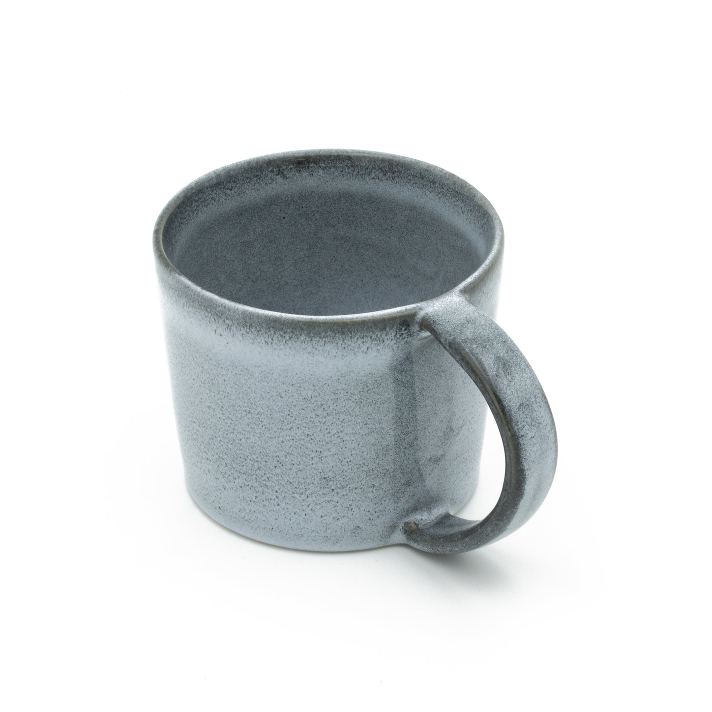 Large blue teacup with handle cropped against a white background
