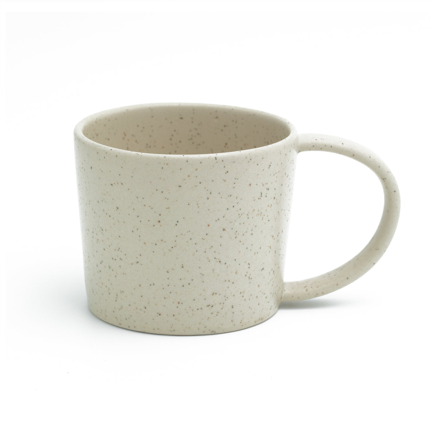 Matt beige tea cup with handle cut out against a white background