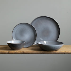 Complete stoneware tableware set with large and small plates, cereal bowl and pasta plate in mottled blue