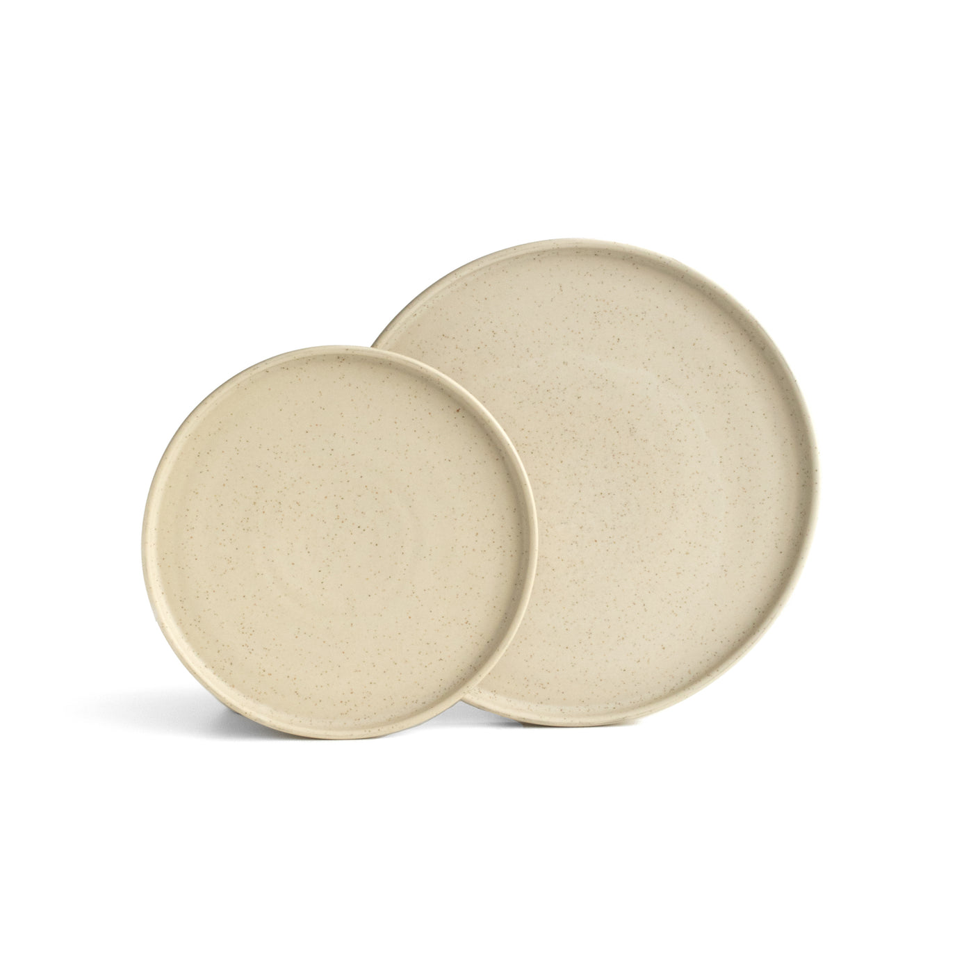 A large and small plate in beige color slightly mottled with straight edge set up and cropped