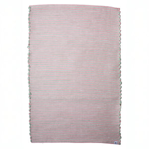 Striped two-tone bathroom rug with pink and mint green stripes hand-woven in Portugal from recycled cotton