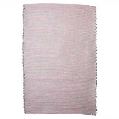 Striped two-tone bathroom rug with pink and mint green stripes hand-woven in Portugal from recycled cotton