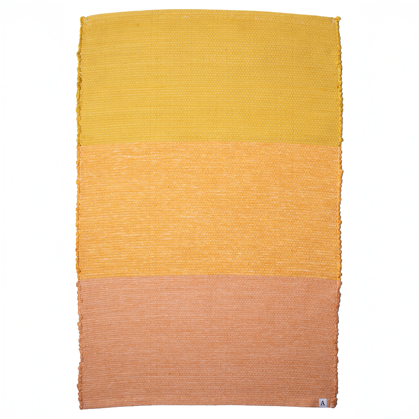 Bathroom rug made from recycled cotton in three shades of yellow and orange