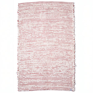 Striped two-tone bathroom rug made of white terrycloth with peach-colored stripes hand-woven in Portugal