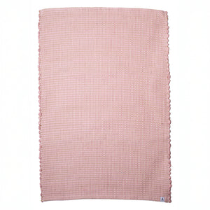 Small jute striped rug in antique pink made from wool remnants hand-woven in Portugal in front of a white background